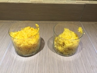 Conventional lemon zest vs. organic lemon zest in clear glasses.