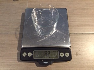 Drinking glass weighed on a food scale.